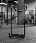 Dumbbell Hook For Pain Free Grips Non Slip Anti Fatigue Weightlifting Accessory with Solid Iron Build in gym setting.