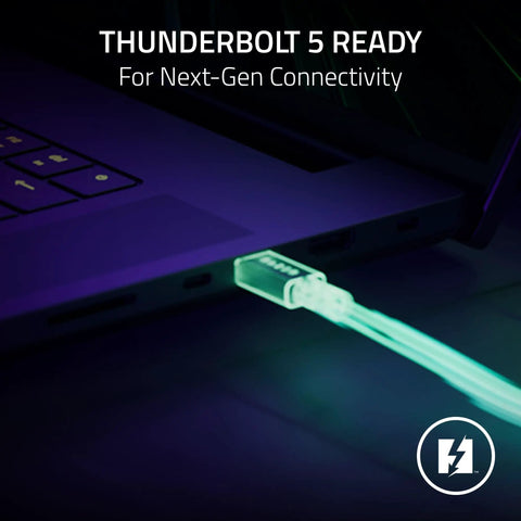 Plug And Play Thunderbolt 5 Dock With Eleven High Speed Ports And One Forty Watt Power Delivery USB C Hub For Seamless Triple Monitor Setups Ethernet Adapter SD Card Reader M Two Storage Expansion For Boss Gamers And Creators On PC Mac, close-up of illuminated Thunderbolt cable connecting to a laptop.