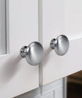 Satin Nickel Cabinet Knobs 20 Pack Single Hole Mushroom Style Round Hardware For Kitchen Cabinets mounted on white doors.