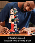 Astro Boy Mechanical Building Set With Clear Version licensed anime figure, half-mechanical design, adult model, on desk