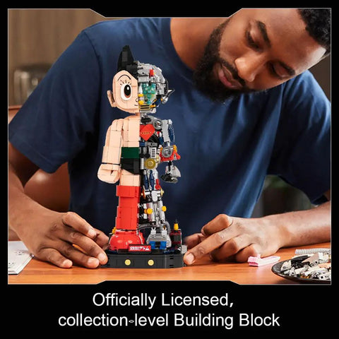Astro Boy Mechanical Building Set With Clear Version licensed anime figure, half-mechanical design, adult model, on desk
