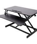 31.5 Inch Height Adjustable Standing Desk Converter Featuring Ergonomic Keyboard Tray And Monitor Riser with black finish and ample support.