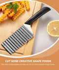 Front view of Healvian stainless steel crinkle French fry cutter with a black non-slip handle on a wooden cutting board.