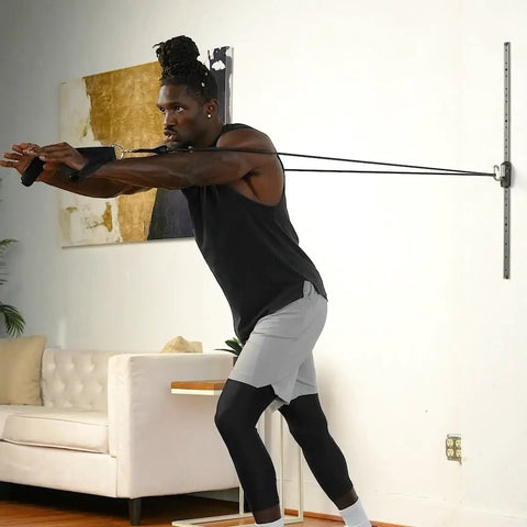 Premium Space Saver Gym Mount With One Steel Rail And One Quick Slide Car To Dominate Your Daily Grind Durable wall anchor system in use with resistance bands.
