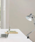 Black Accent Desk Lamp With Clamp Arm And Interchangeable Base on office desk, Architect Style Task Light in modern workspace