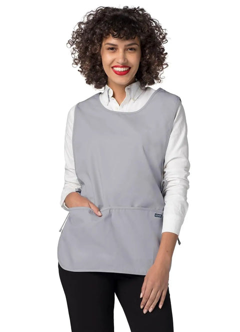 Heavy Duty Cobbler Apron Set Of Six With Deep Front Pockets And Adjustable Waist For Nurses Crafters And Mechanics Works Like A Champ Built Tough For The Daily Grind In Sharp Silver Gray worn by a smiling woman.