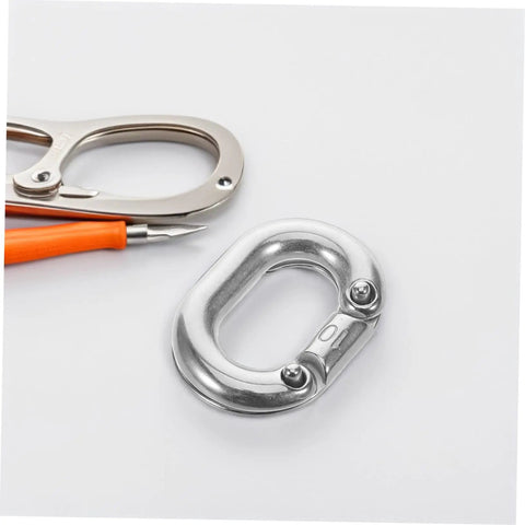 Heavy Duty Stainless Steel Chain Link Connector With Hassle Free Quick Connect Coupler on white surface with scissors.