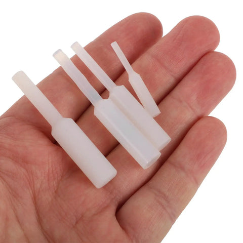 Top Pick 20 Piece High Temp Silicone Plug Straight Hole Stopper Kit Perfect For Powder Coating And Spray Painting Jobs Featuring Durable Round Open Design For Easy Insertion And Removal To Keep Dust Out And Holes Secure On Any Project. White silicone straight hole stoppers in hand