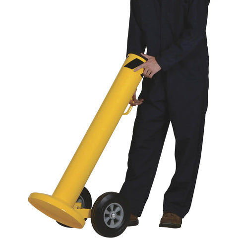 Heavy Duty Movable Safety Bollard With Durable Casters For Warehouse Workshop Protection 42 Inch Tall being moved by a worker.