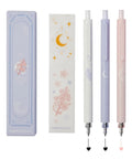 Gel Pens Set Cute Stationery Trio With 0.5mm Fine Point Quick Dry Ink For Journaling And Aesthetic Office Vibes Two Black And One Coral Ink Smooth Write No Skip No Bleed. Three gel pens with floral designs and two-tone ink alongside matching packaging.
