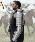 Medieval Single Pauldron Spartacus Cosplay Armor Arm Sleeve for LARP Gladiator Knight Costume worn by a man outdoors