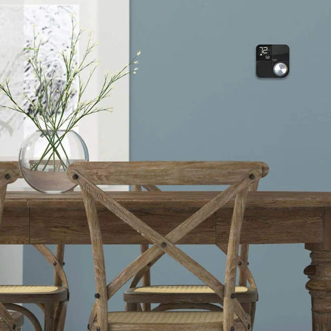 Smart Wifi Thermostat With Alexa And HomeKit Geofencing Capable Works With Google Assistant Cloud Control on a blue wall in dining area