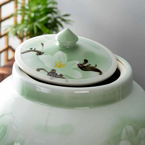 Total Pantry Flex That Keeps Grains Sealed Tight This Large Green Ceramic Rice Jar with floral lid design.
