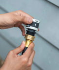 Close-up of installation of Garden Hose Quick Connector Set With Water Stop And Lock Quick Release Kit Universal Fittings And Adapters