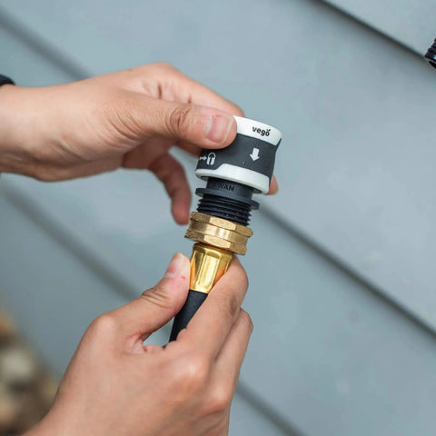 Close-up of installation of Garden Hose Quick Connector Set With Water Stop And Lock Quick Release Kit Universal Fittings And Adapters
