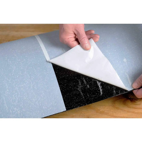 Heavy Duty Rubberized Asphalt Wind And Water Seal Underlayment Single Roll with adhesive backing being unpeeled.