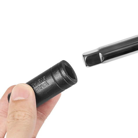 Close-up of Tap Socket Set For One Quarter Inch And Three Eighth Inch Drive Pro Grade showing black socket held by hand.