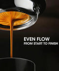 Close-up of espresso shot pouring evenly with magnetic espresso WDT tool for even extraction 10 needle stirrer puck tool visible.