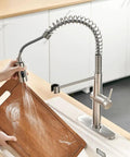 Pull Out Kitchen Faucet With Sprayer Low Lead Pro Grade Single Handle Pull Down Sprayer Brushed Nickel Finish in use with cutting board