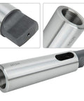 MT5-to-MT4 taper reducing drill sleeve in silver high-speed steel; shows bore opening and drive end.