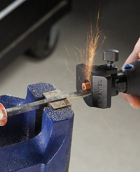 Heavy Duty 130 Watt Rotary Multi Tool Powerhouse demonstrating cutting capability with sparks flying from metal in a blue vice.