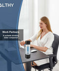 Woman at desk with Hydrogen Water Generator Bottle With Dual Chamber SPE PEM Tech, 4000mAh Battery, portable for travel