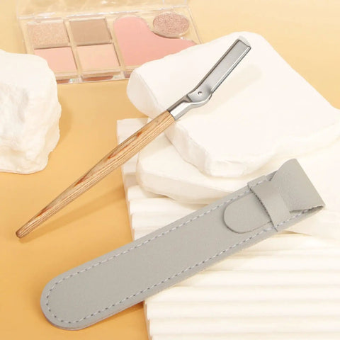 Get Your Brows In Tip Top Shape With This Manual Eyebrow Shaper Trimmer Featuring A Wooden Handle And Safety Mesh Guard For Dead On Facial Hair Removal For Men And Women Plus Stainless Steel Refills, displayed with a gray case.