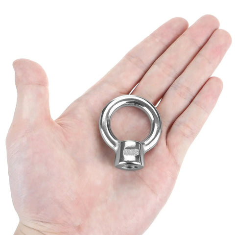 Rock Solid Boss Level Marine Grade Stainless Steel Lifting Eye Nut in hand, 3/8 inch UNC thread, ready for heavy duty rigging jobs.