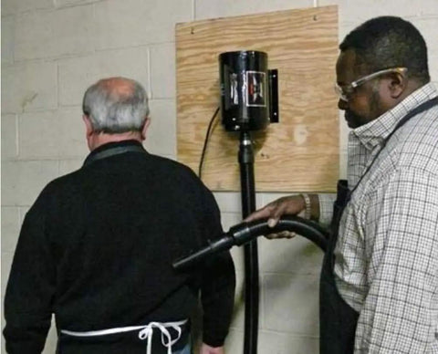 Man demonstrating Industrial Air Blaster For Quick Kickin It Clean Cleanup Of Clothes Surfaces Electronics And Car Interiors