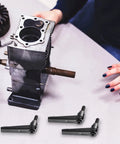 Three Piece Zinc Alloy Clamping Lever Thumb Ratchet for Trailer Jack Handle shown beside a mechanical component on a table.