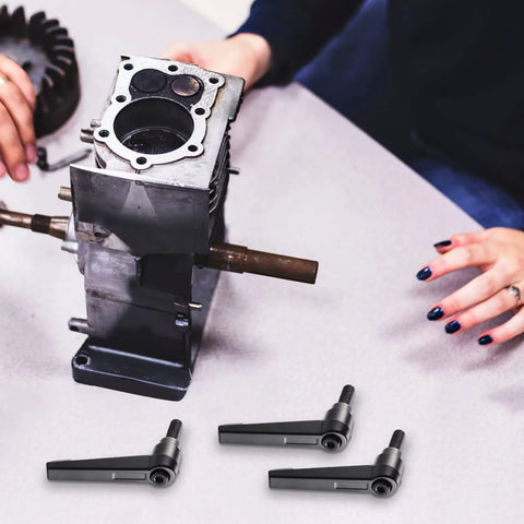 Three Piece Zinc Alloy Clamping Lever Thumb Ratchet for Trailer Jack Handle shown beside a mechanical component on a table.
