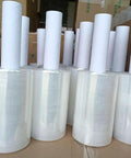 Top Shelf Clear Stretch Wrap 6 Inch By 1000 Feet Plastic Roll stacked for moving, shipping, and packing heavy items.