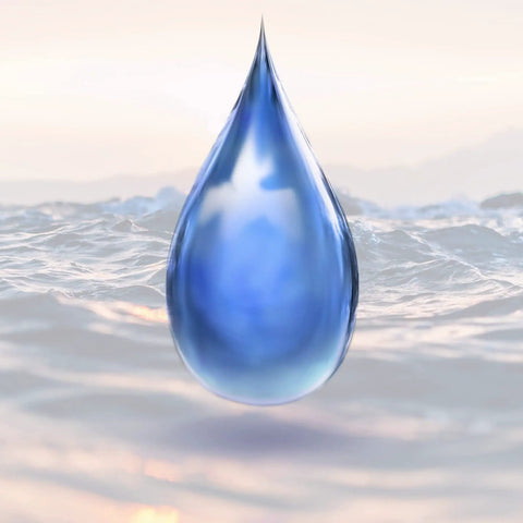 A single blue water droplet over a blurred ocean background at sunrise, representing Water Slide Decal Paper For Inkjet Printers Clear US Letter Size 8.5 By 11 20 Sheets Transparent Printable Paper For Your Own Custom Decals On Tumblers Glasses And Mugs.