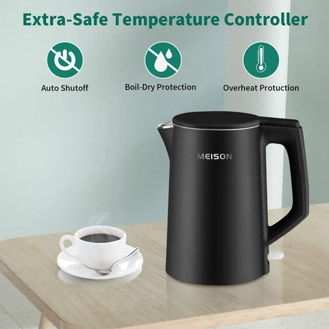 Black 1.7 Liter Electric Kettle With Double Wall Stainless Steel Interior, Fast 1200W Boil, Auto Shut Off on kitchen table
