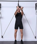 Man using Heavy Duty Gym Pulley System With Wall Mount Single Pulley Block Silent 360 Degree Swivel Wheel for exercise