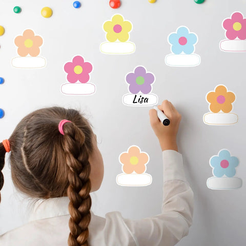 Child writing on 180 Pcs Flower Name Tag Stickers Set For Back To School, Pastel Floral Desk Labels on whiteboard