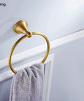 Brass Bathroom Accessories Set With Adjustable Towel Bar From 16.53 To 28.42 Inches Vintage Brushed Brass Wall Mounted Bath Hardware Kit Durable Solid Brass Construction Timeless Antique Look Must Have Home Upgrade For Your Bath showing round towel ring with towel mounted on wall.