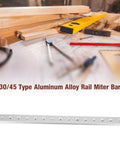 Premium T Slot Miter Track Jig For Woodworking Aluminum Miter Bar Track in workspace with tools and wooden planks