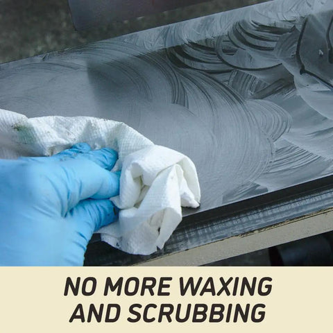 A hand cleaning the surface of an Industrial Grade 16 Inch Parallelogram Jointer With Helical Cutterhead using a cloth.