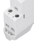 Close-up of a white energy monitor plug connector with labeled connection points, used for energy monitoring applications.