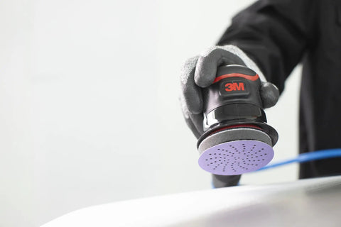 Kick Some Serious Grit With These 3M Cubitron II Hookit Abrasive Discs For Auto Work, 3 inch sander with dust holes in action.