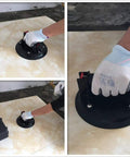 Using 8-Inch Glass Vacuum Lifter Handheld With Handle to lift tile, showing durable design and grip, includes carrying case.