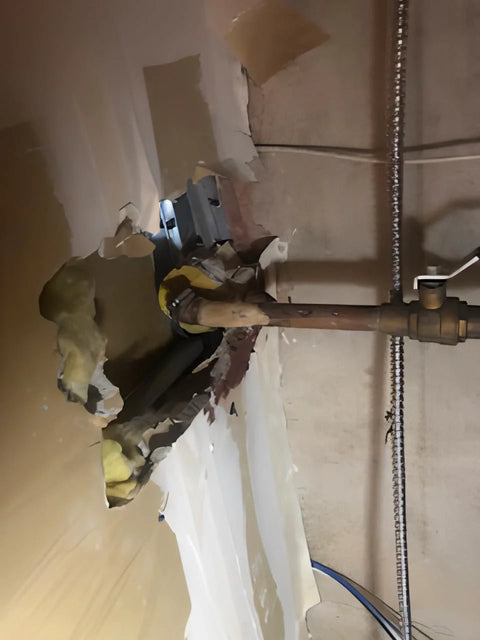 Damaged wall with exposed pipe ready for Emergency Pipe Repair Kit With 12 Patches And Clamps For Quick Leak Fix On One Quarter To One And A Quarter Inch Copper PVC And Metal Pipes No Water Shut Off Easy To Use Do It Yourself Patching For Straight Pipes And Elbows.