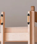 9 Inch Beech Wood Barn Door Pull Handle With Plastic Brackets installed on wood structure, showing smooth round edges for safe kids.