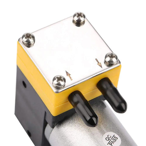 Close-up of 24V Slick Miniature Diaphragm Vacuum Pump With 0.4 To 1 L Per Min Flow For Air And Liquid, top view with connectors visible.