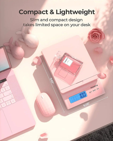 Killer Digital Postal Scale Measures Every Package Up To 66 Pounds With Dead On Precision So You Can Ship Heavy Goods Without Stress While The Sleek Pink Surface Looks Absolutely Dope on a desk with pink accessories. 