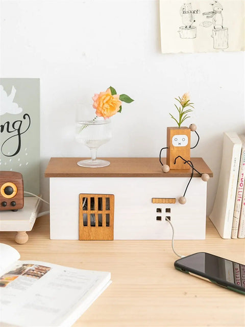 Hidden Cable Management Box Organizer for Home Office and TV Setup in wooden style on desk with phone and books