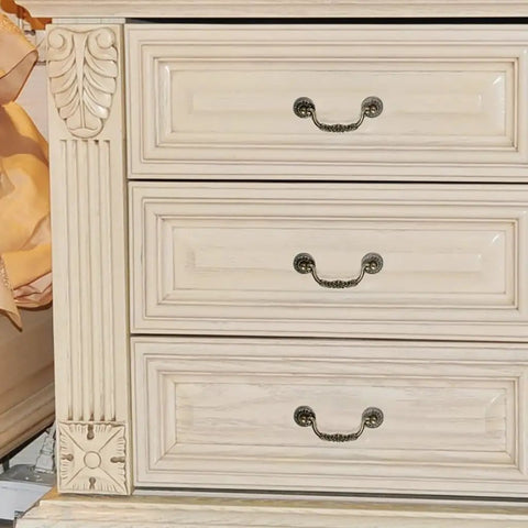 Straight Up Vintage Antique Bronze Drop Bail Pulls With Slick Carved Texture on white dresser drawers.