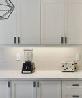Matte Black Cabinet Knobs 2 Inch 50mm 10 Pack Single Hole Kitchen Cabinet Pulls visible on white cabinets