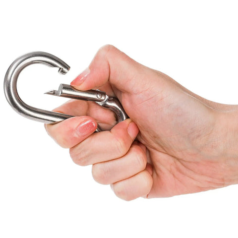 Hand holding 3 Pack Horse Tie Ring Set For Horses 304 Stainless Steel Training Rings, showing magnetic quick-attach feature